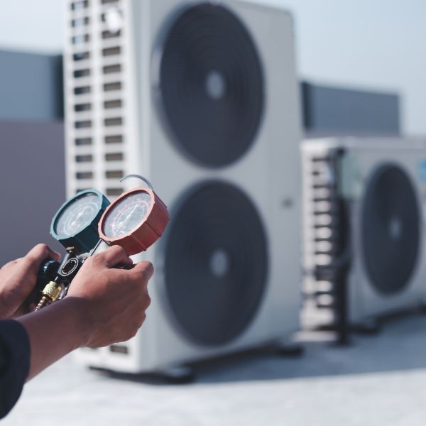 hvac technician checking meters