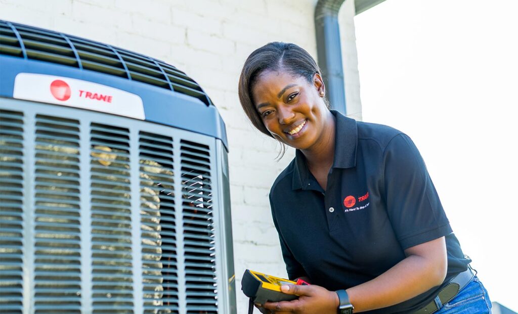 Trane tech checking on a newly installed unit