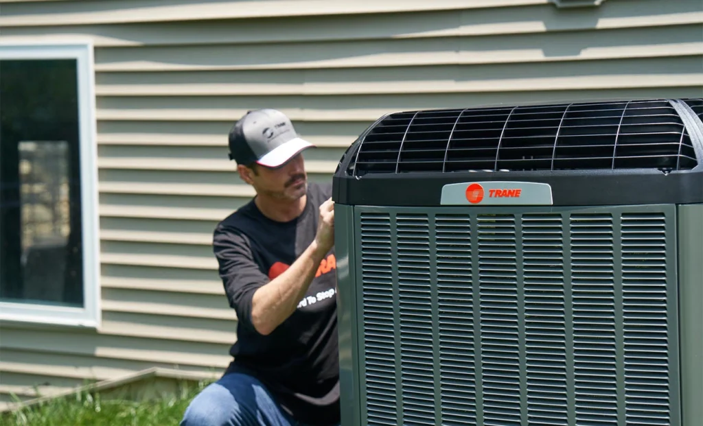 trane-employeeworkingonunitoutdoors updated
